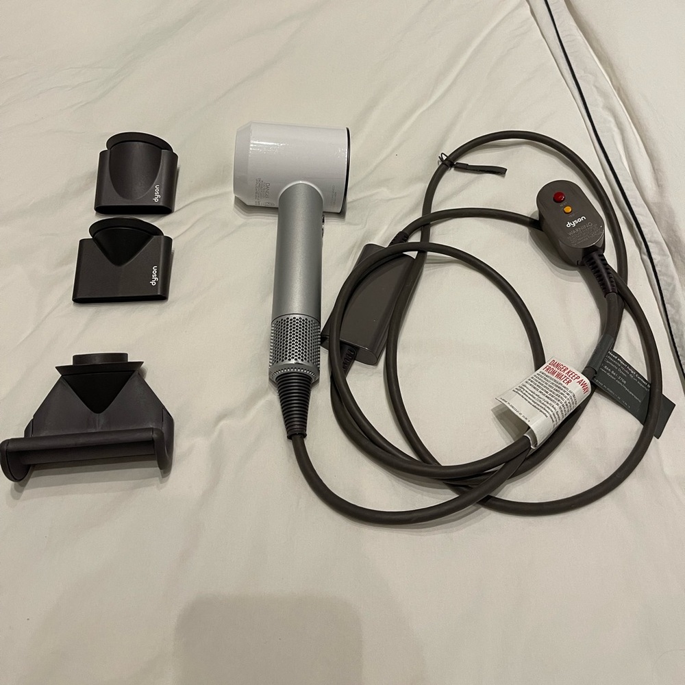 Dyson White and Silver Hair Dryer with Dark Gray Attachments